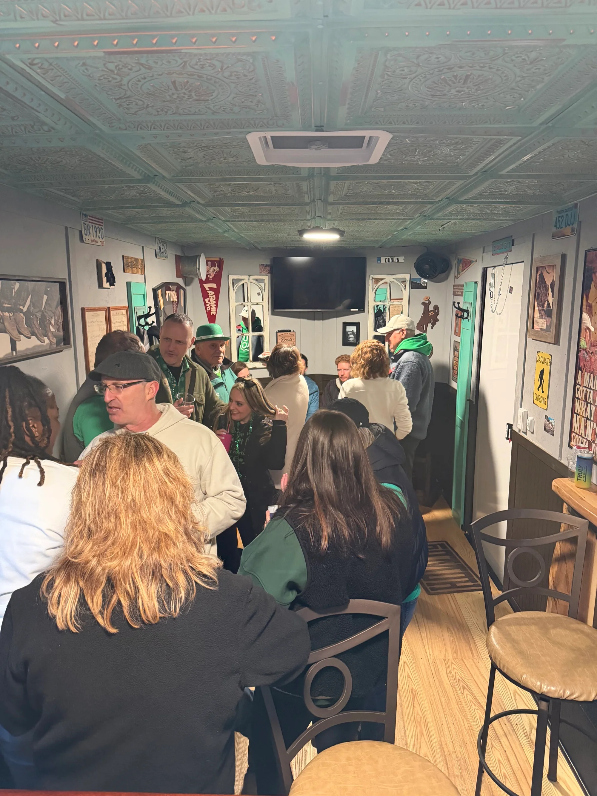 Guests enjoying drinks inside Jack's Wagon