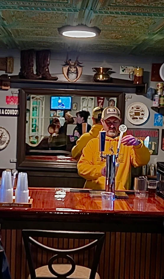 Patron pouring themselves a pint inside Jack's Wagon